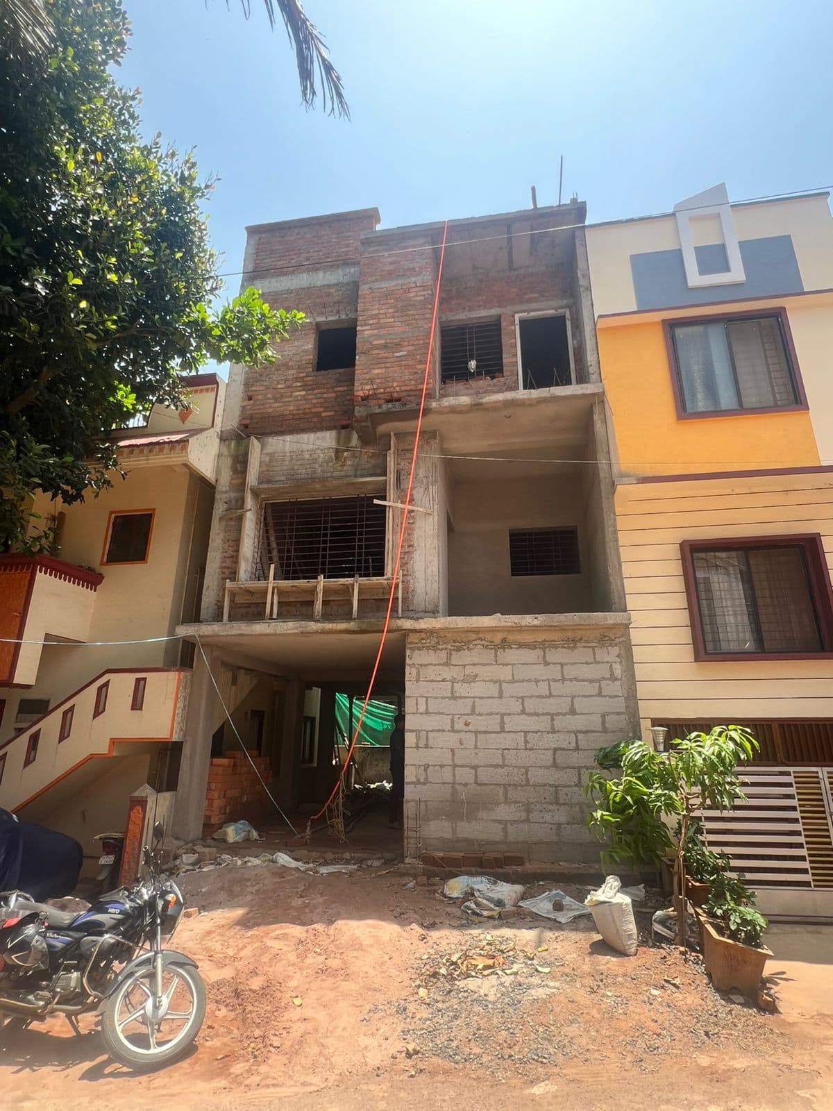 Ongoing residential construction site in Belagavi with RCC framing